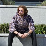 I am native English speaker, and can help with different dialects of the English language